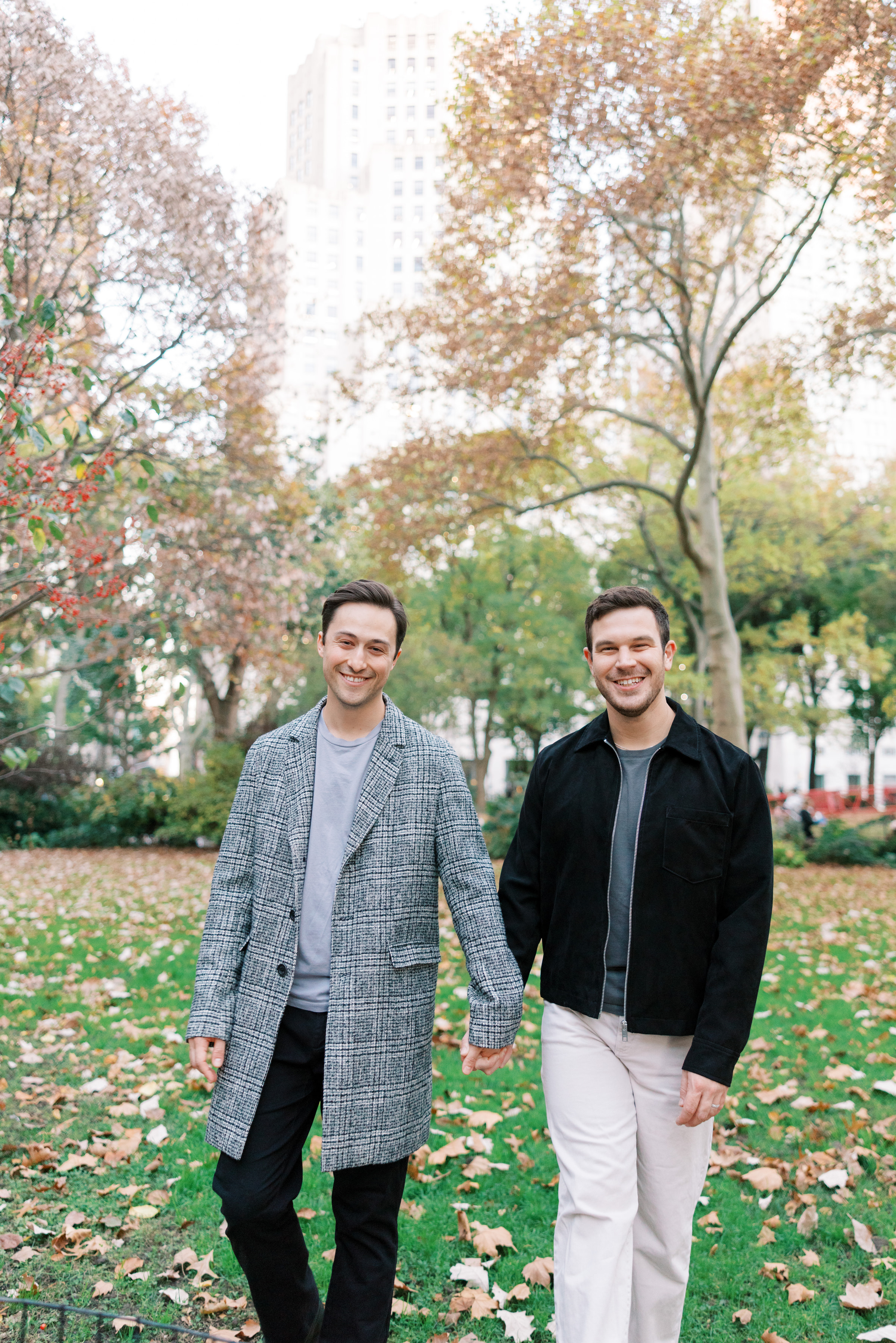Phil and Zack walking hand in hand in New York City